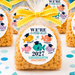 Packaged snacks with fish-themed labels on a colorful underwater-themed background