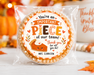 A round custom treat cookie in a clear plastic bag, featuring a printed round label that reads 'You're an IMPORTANT PIECE of our team! Thank you for all you do!' with a pie illustration and the name 'MRS. CLARKSON'.