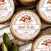 Five round metal jars of apple butter arranged on a striped fabric surface with red apples, leaves, and a wooden spoon around them. The labels read 'Homemade Apple Butter' with autumn apple illustrations and the date Autumn 2027.