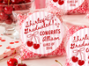 Graduation-themed cookies with personalized messages on a festive background.
